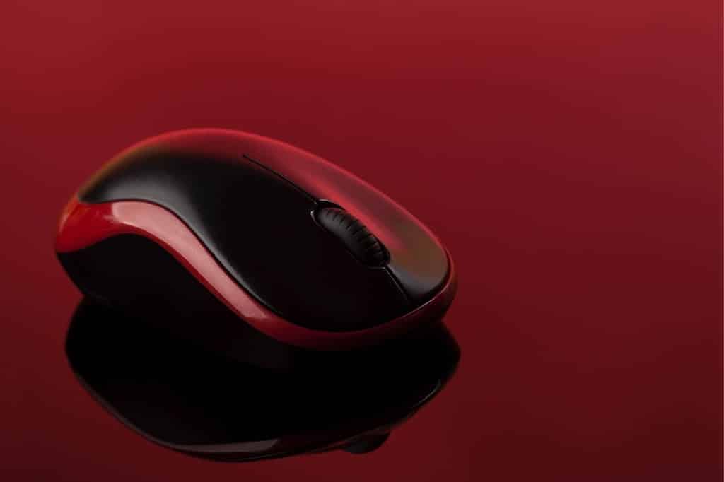 PC mouse on red background