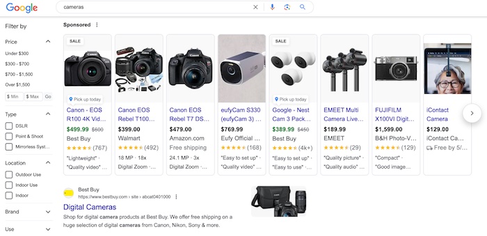 Google search query for "cameras" keyword. Sponsored results section